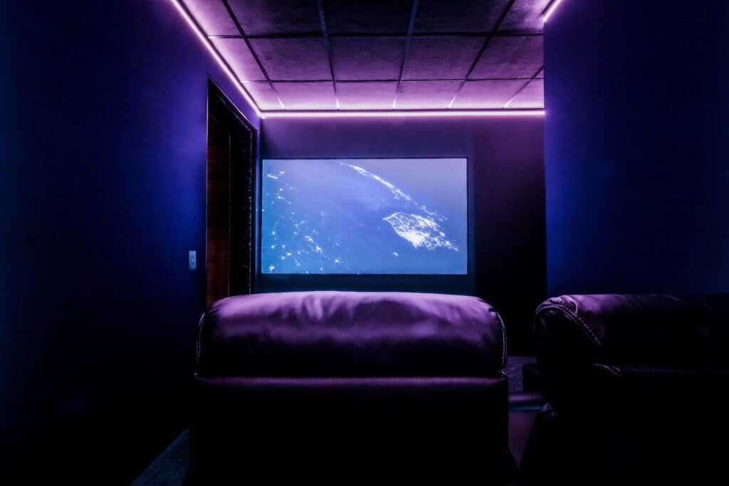 A great view of the acoustically transparent projector screen in the shelter home theater. 