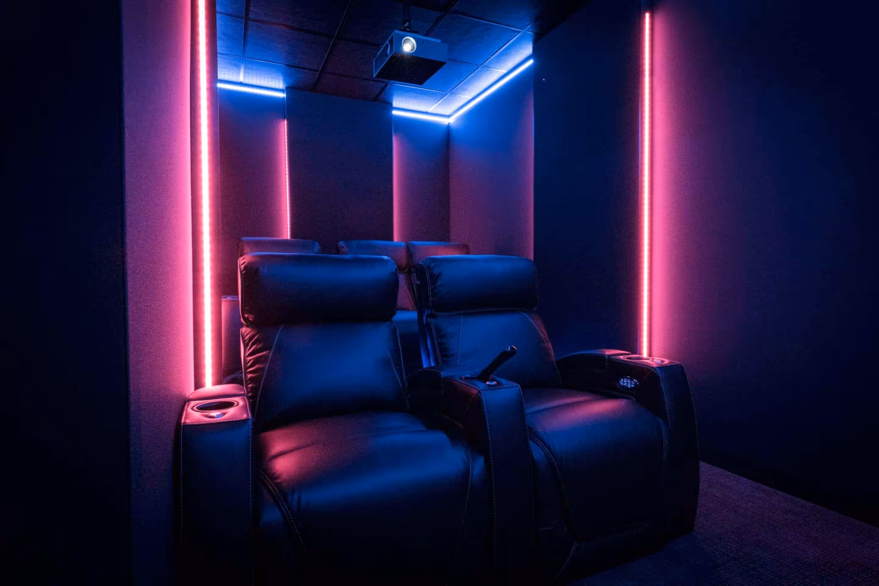 Side view of a dedicated home theater with a film on screen