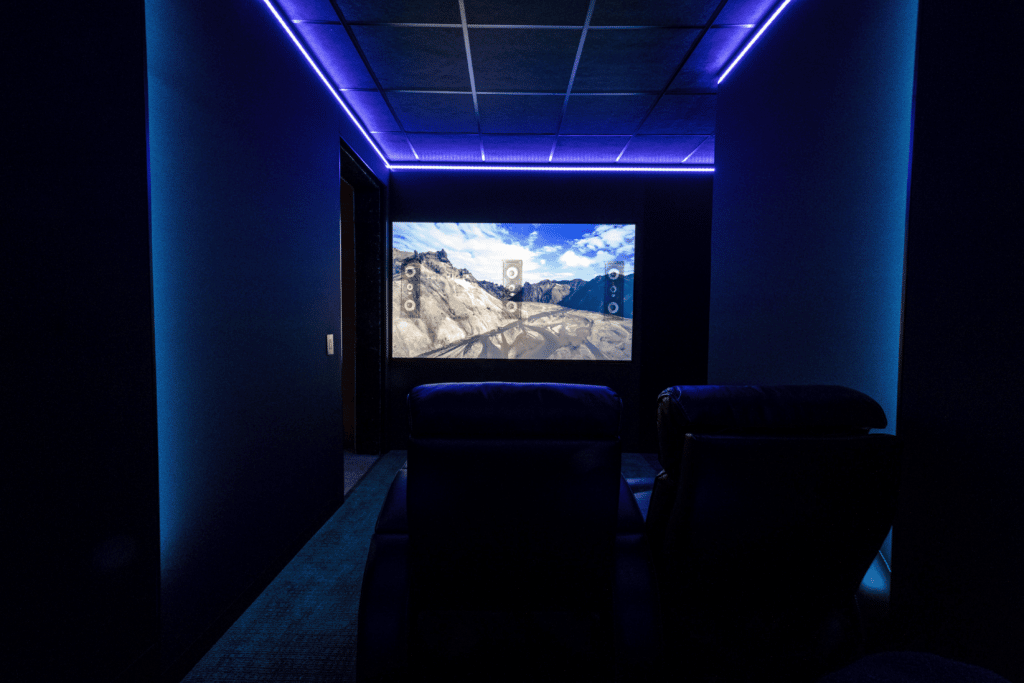 An Illustration Showing The Focal 300 Series In-Wall Speakers Hidden Behind The Projector Screen In The Home Theater. 